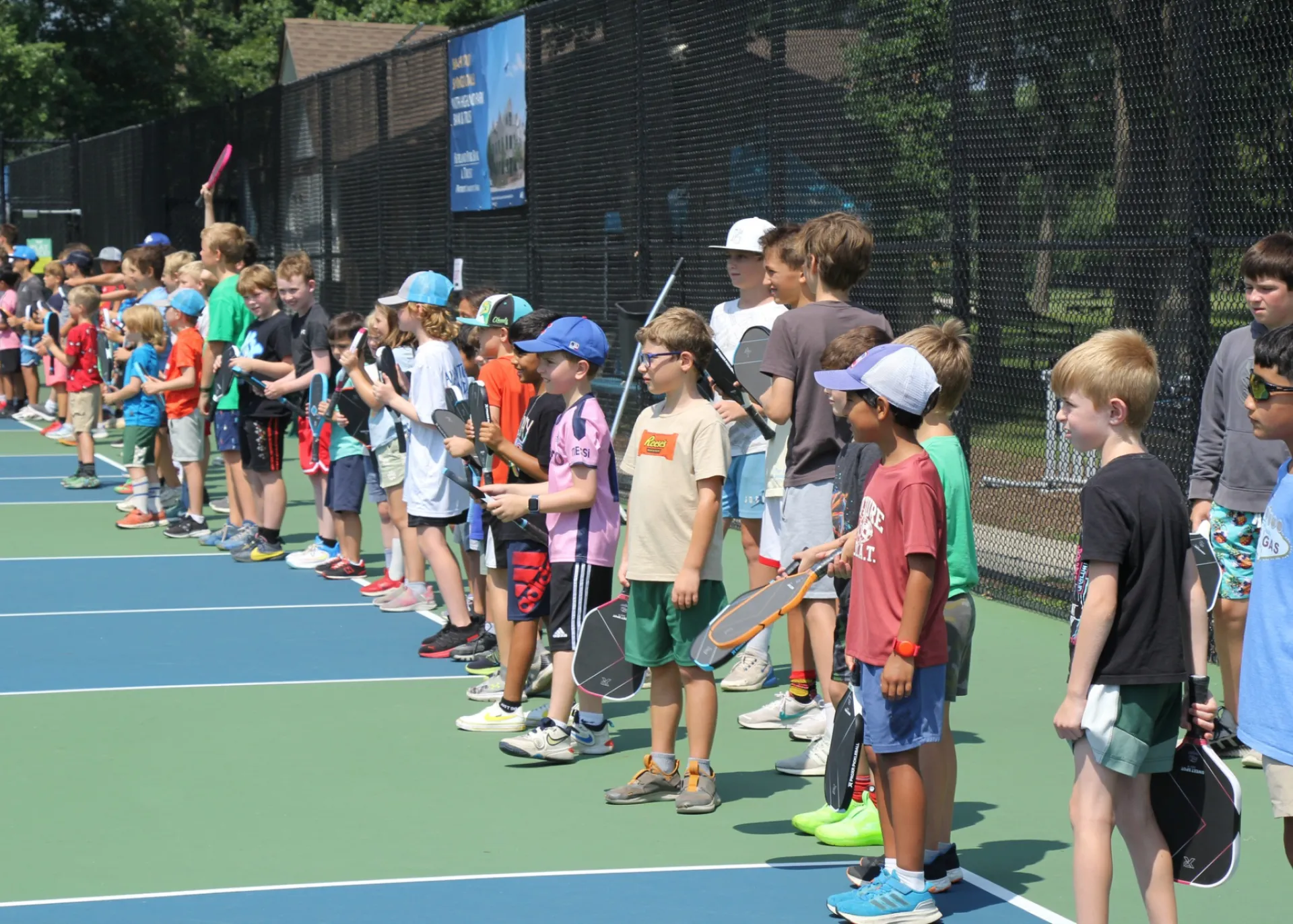 Group of kids lined up at Worlds Largest Pickleball Lesson 2025