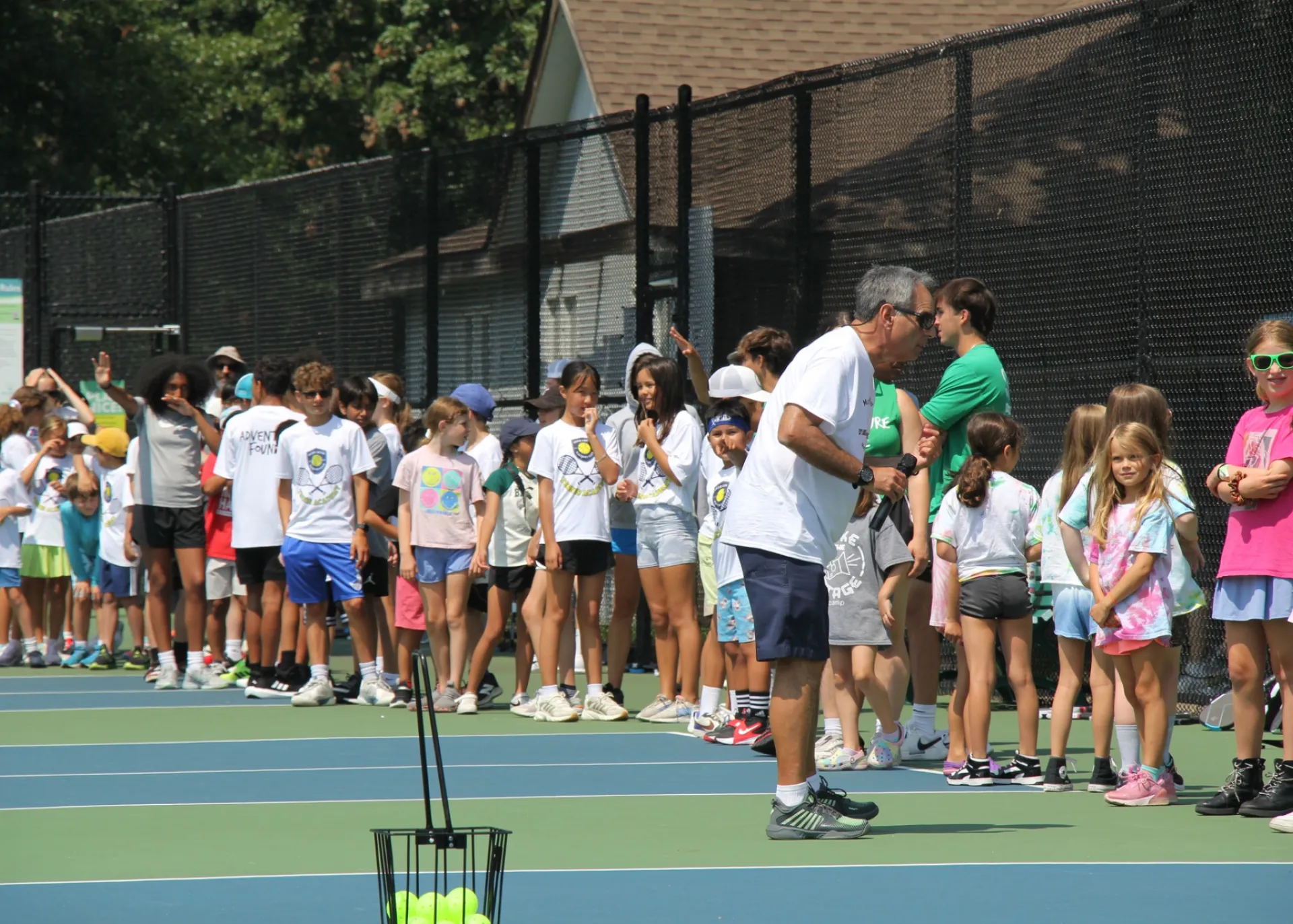 Mark Miller Speaking to Group of Kids at Pickleball Lesson