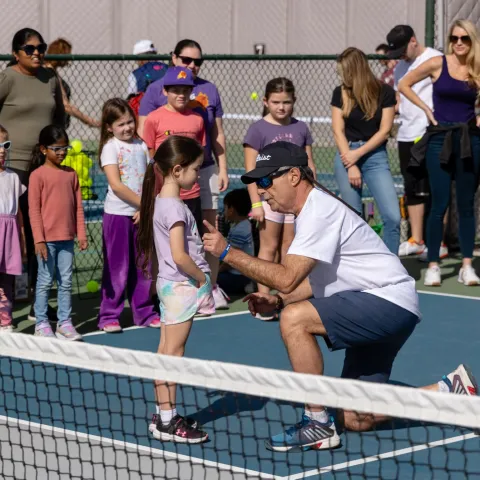 Mark Miller in lesson with young girl on pickleball court