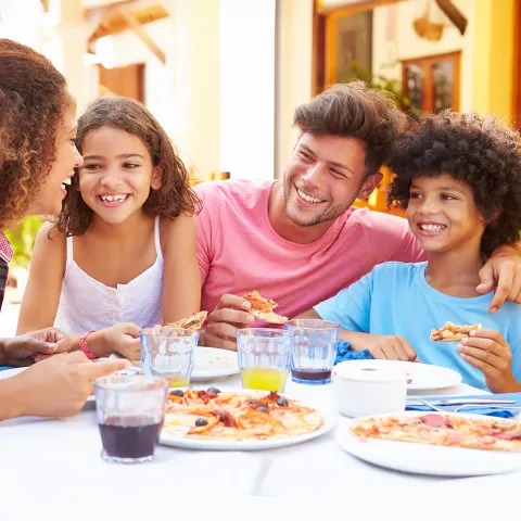 Family dining at an outdoor restaurant